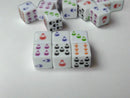 Set of dice with potion symbols on a reflective surface