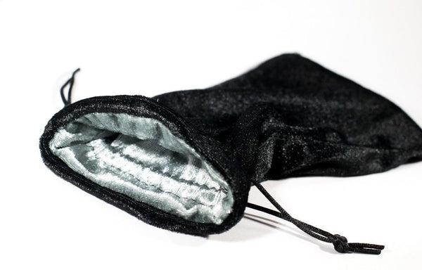Soft black velvet bag with grey velvet lining. Drawstring closes bag tightly. Bag can be used for holding 60-100 dice or cards / tarot cards. Bag would also make a great gift bag!