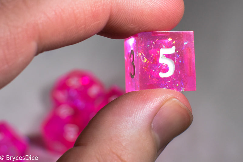 Fairy Flare Sharp Edge Resin 7-Dice Dice (Pink w/ White Numbers)