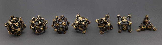 Gold Deadly Skull Dice Hollow Metal 7-Dice Set